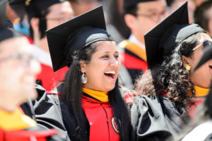 Graduates laugh during commencement speaker Steven Levitan's address during UW-Madison's spring commencement ceremony at Camp Randall Stadium at the University of Wisconsin-Madison on May 13, 2017. The outdoor graduation is expected to be attended by more than 6,000 bachelor's and master's degree candidates, and their guests. (Photo by Bryce Richter / UW-Madison)